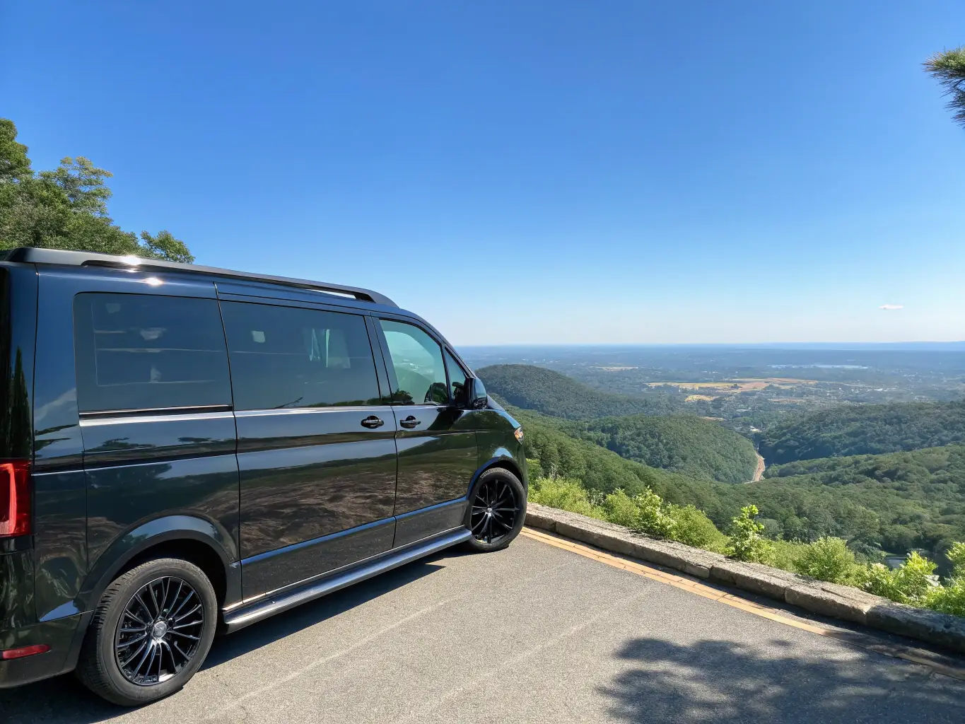 A scenic image of an RV parked in front of a breathtaking mountain range at sunset, representing the RV travel edition of Escape and Explore.